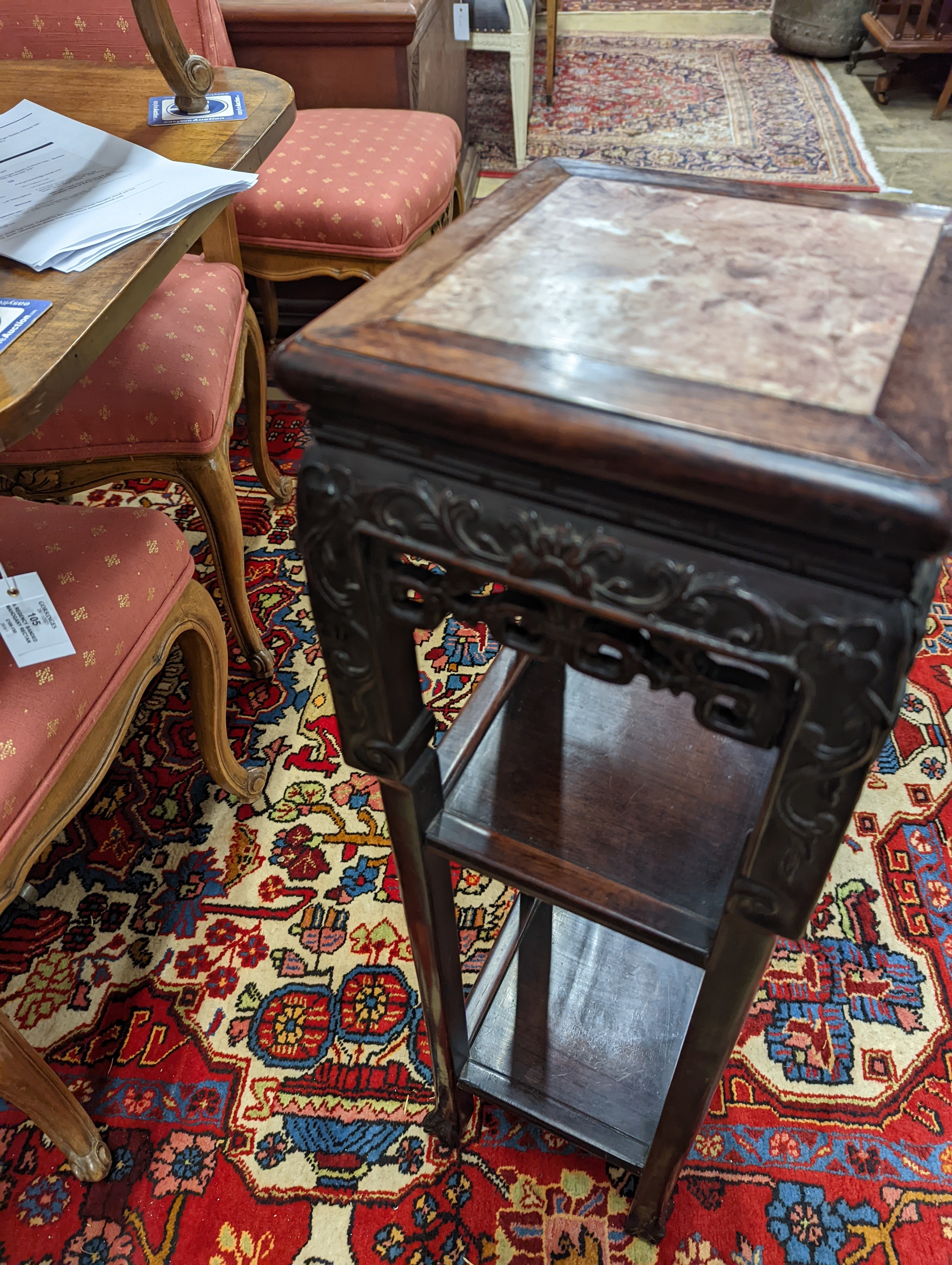 A Chinese carved hardwood three tier jardiniere stand, marble inset, width 22cm, depth 22cm, height 82cm